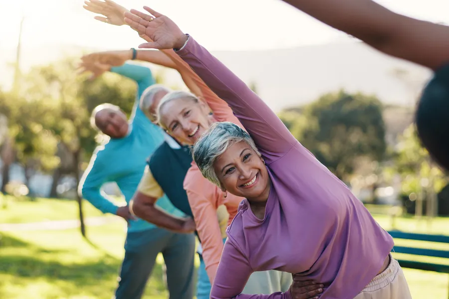 Seniors stretching outside